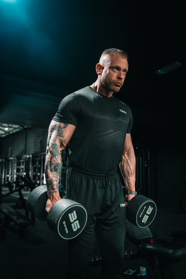 DMF Athletics - 1DMF - Experience ultimate comfort and performance with our Performance Tee. Made with high-quality materials, this tee is designed to enhance your athletic abilities and keep you cool and dry. Perfect for any active lifestyle, this tee is a must-have for athletes and fitness enthusiasts alike. Boost your performance with our Performance Tee